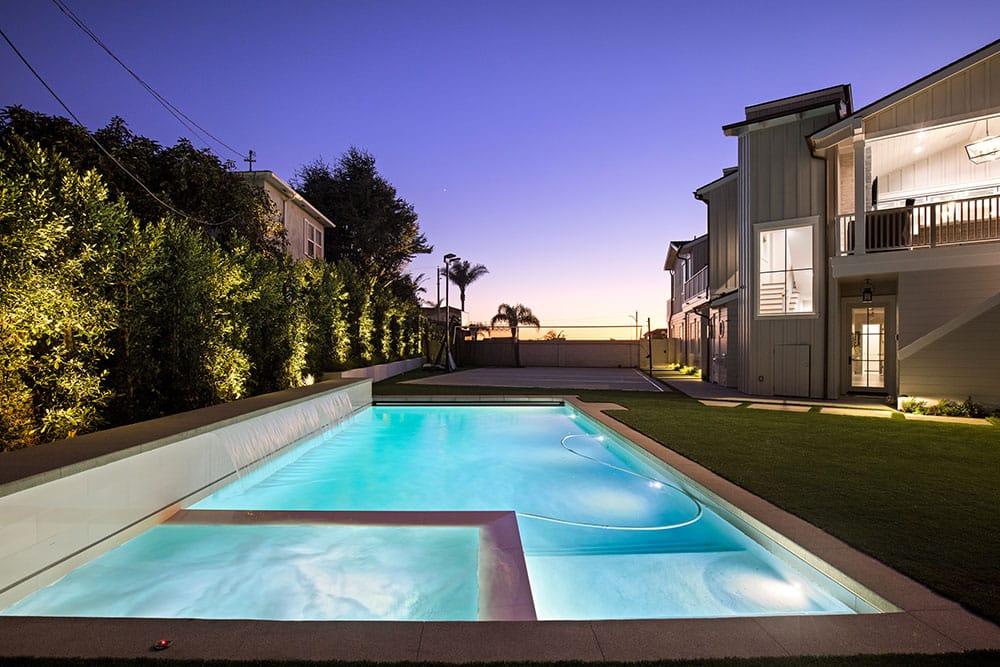 Backyard pool with waterfall Redondo Beach by Premier Builders Pool & Spa